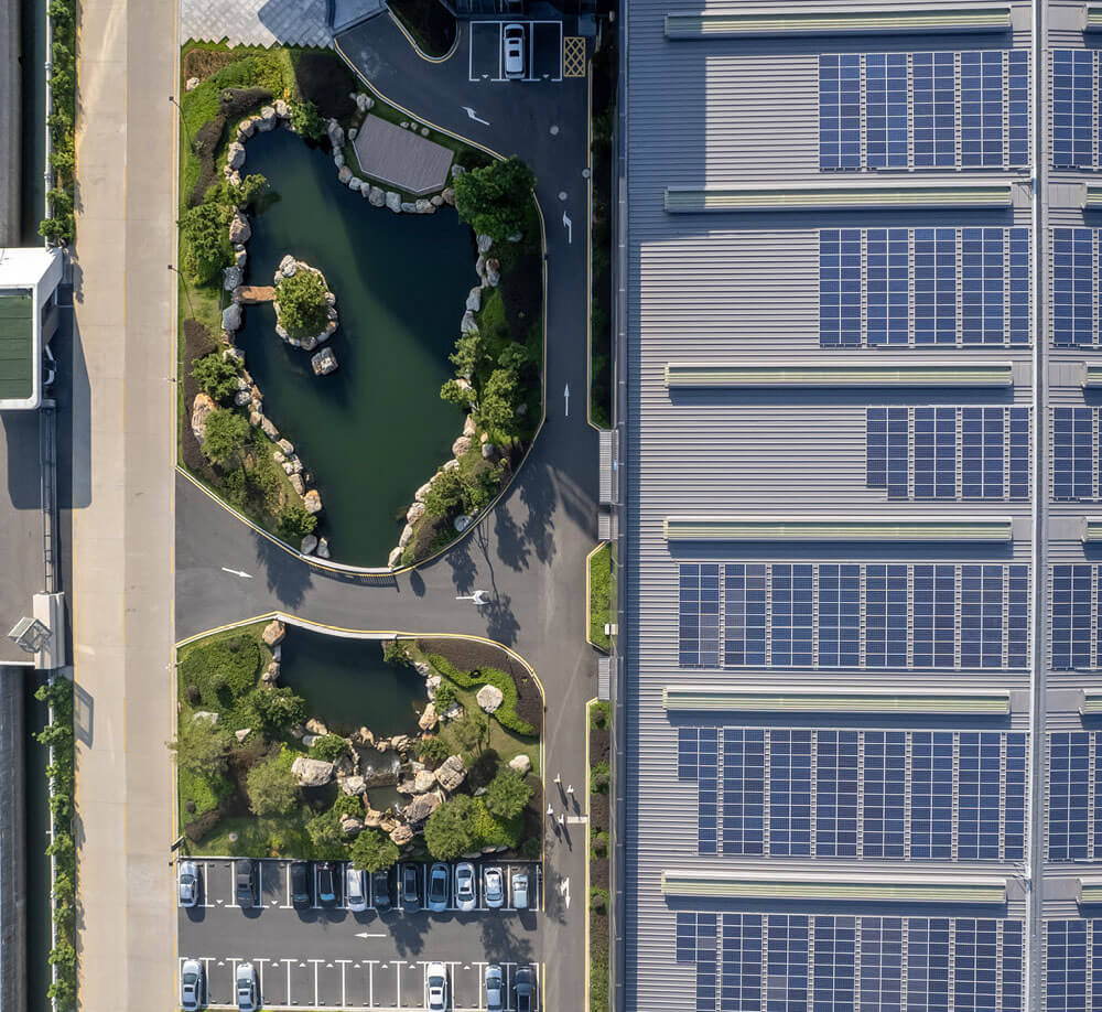 parking lot with solar panels Aerial view of a parking lot featuring rows of solar panels installed over parked cars